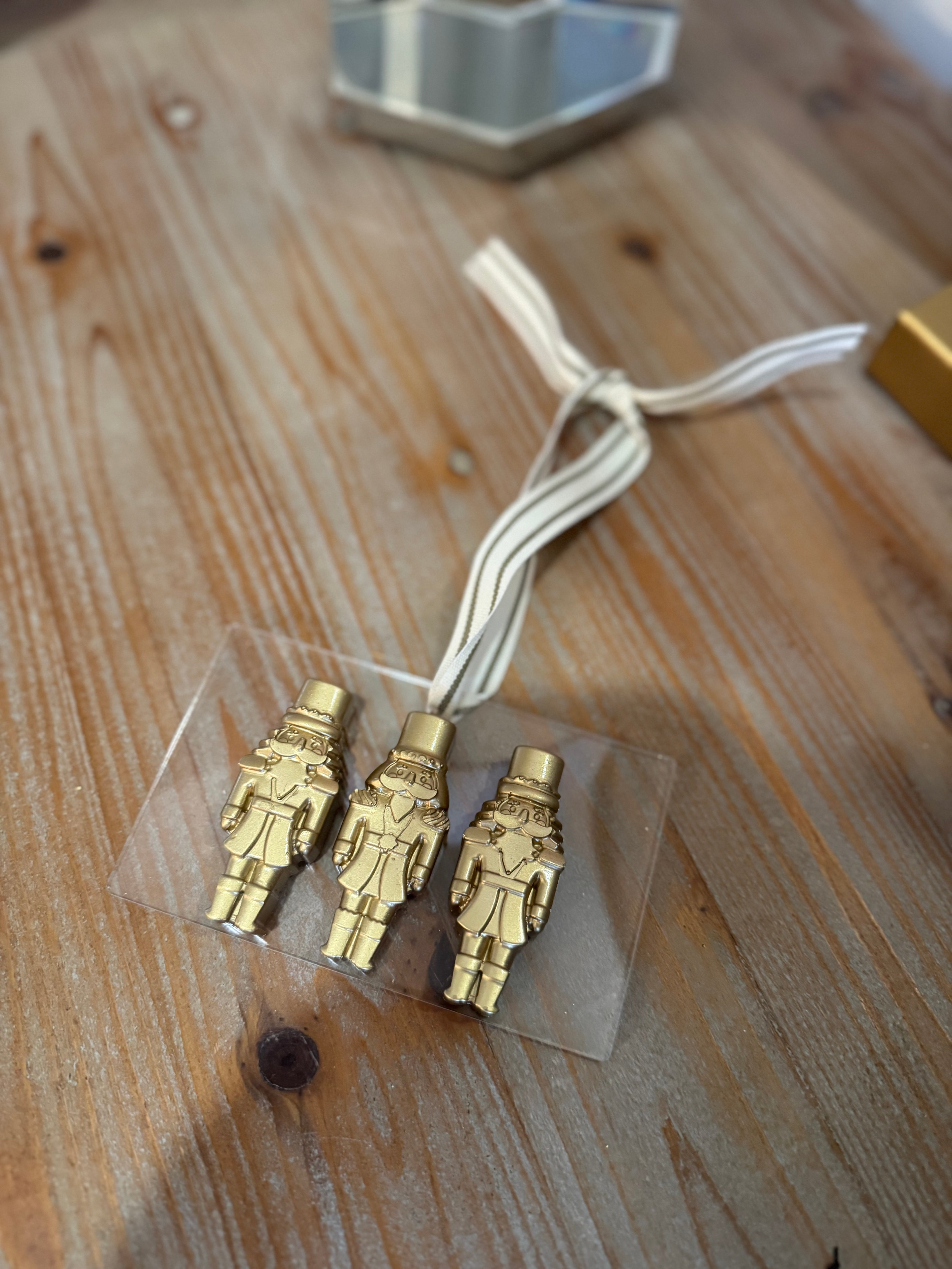 gold and acrylic nutcracker christmas wreath ornament